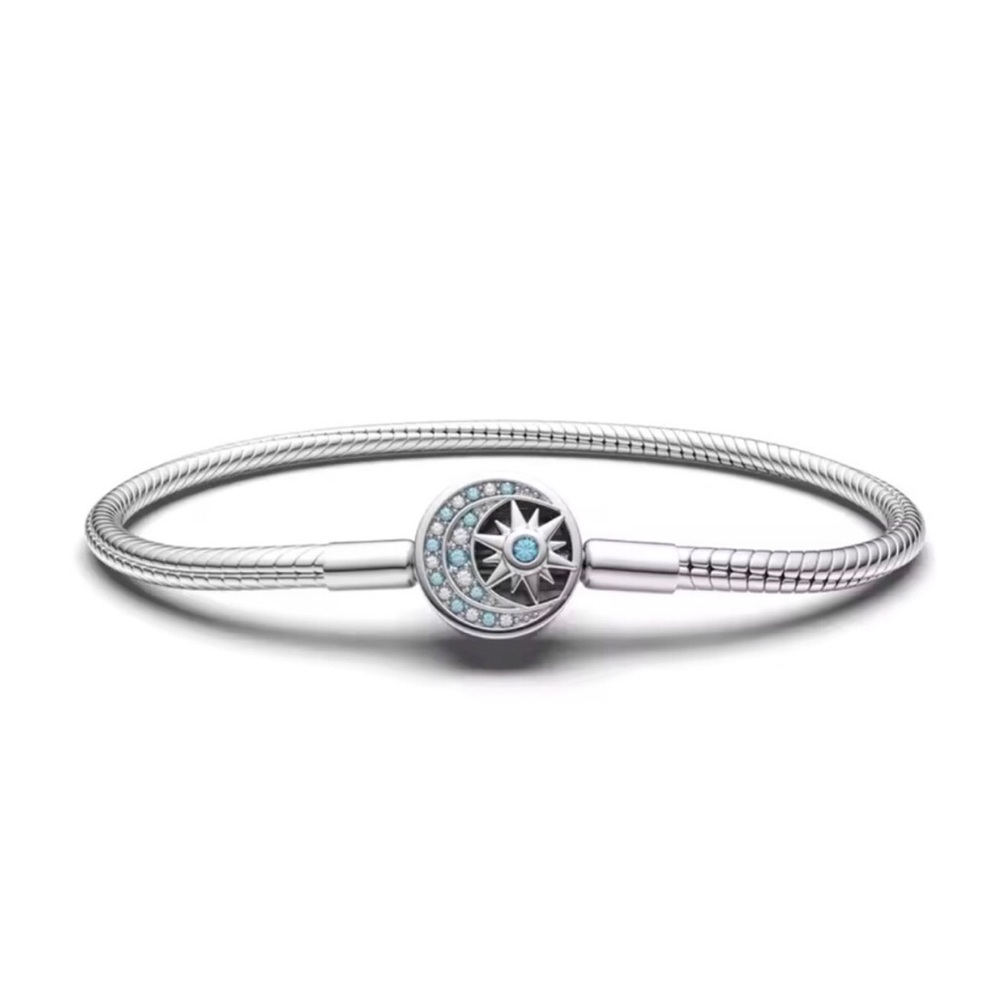 Sterling Silver Compass Charm Bracelet with Light Blue Accents
